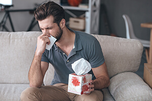 Man suffering from eye allergies