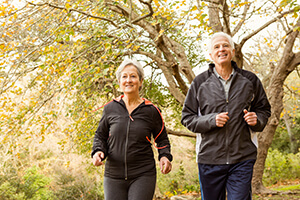 Older man and woman walking after Diabetic Retinopathy treatment