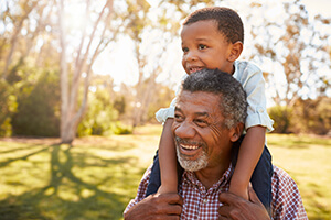 Old man with Grandson smiling after glaucoma treatment